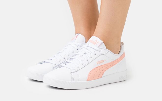 Woman is Wearing Puma Smash Leather Sneakers in Apricot Blush Color