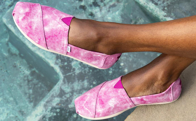 Woman is Wearing TOMS Pink Distressed Alpargata