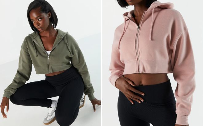Woman is Wearing a Cropped Fleece Hoodie in Dark Green Color on the Left and in Light Pink Color on the Right Side Woman is Wearing a Cropped Fleece Hoodie in Dark Green Color on the Left and in Light Pink Color on the Right Side