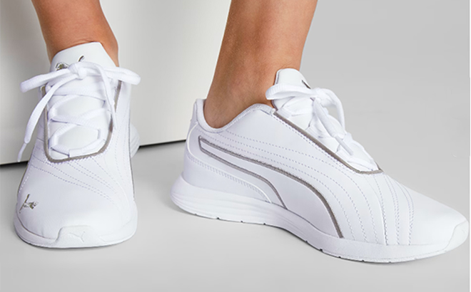 Woman wearing the Ella Lace Up Womens Shoes in Puma White Puma Silver 1