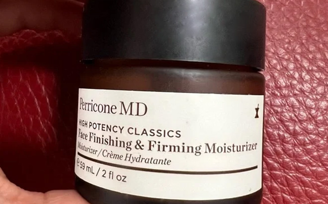 a Hand Holding a Perricone MD Face Moisturizer