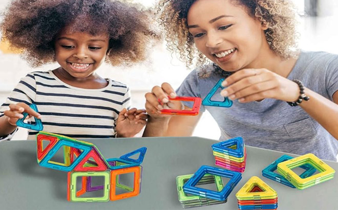 an Image of a Girl and a Woman Playing with a Magnetic STEM Building Blocks an Image of a Girl and a Woman Playing with a Magnetic STEM Building Blocks
