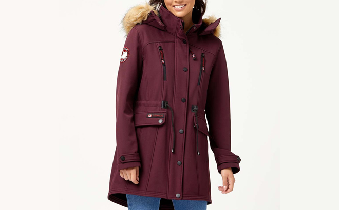 an Image of a Woman Wearing a Canada Weather Gear Cranberry Natural Cinched Waist Hooded Anorak