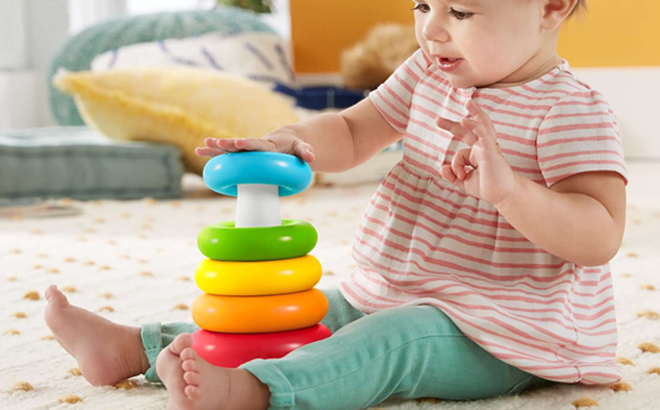 A Baby Playing With Toys on the Floor