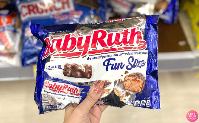 A Hand Holding a Baby Ruth Chocolate Bars Fun Size