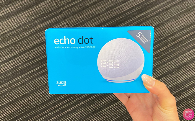A Hand Holding the Echo Dot 5th Gen 2022 Release