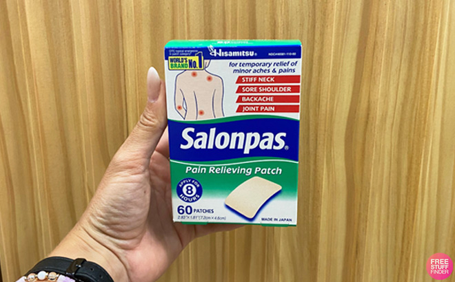 A Person Holding a Salonpas 60 Count Pain Relieving Patch A Person Holding a Salonpas 60 Count Pain Relieving Patch