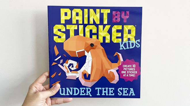 A Person holding a Paint by Sticker Kids Under the Sea