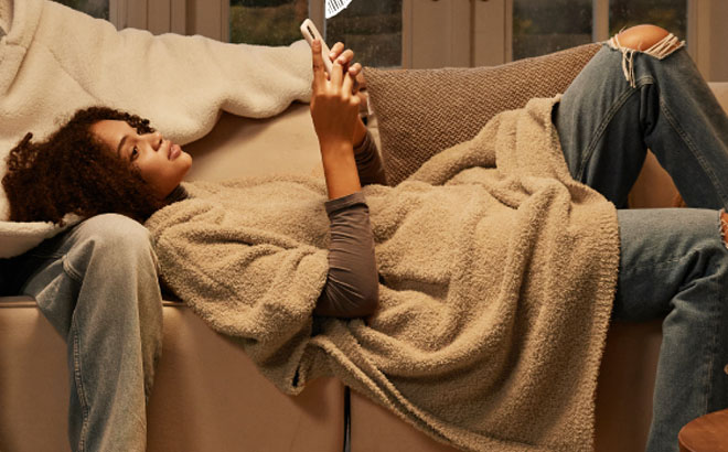 A Woman Wearing a Bedsure Oversized Wearable Blanket Hoodie