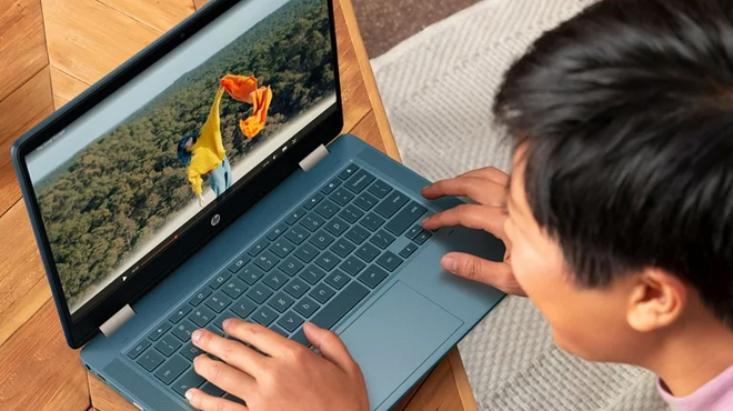 A boy using HP 14 X360 Touchscreen Chromebook
