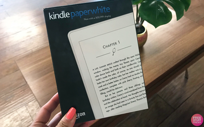 A Person Holding an Amazon Kindle Paperwhite in a Box