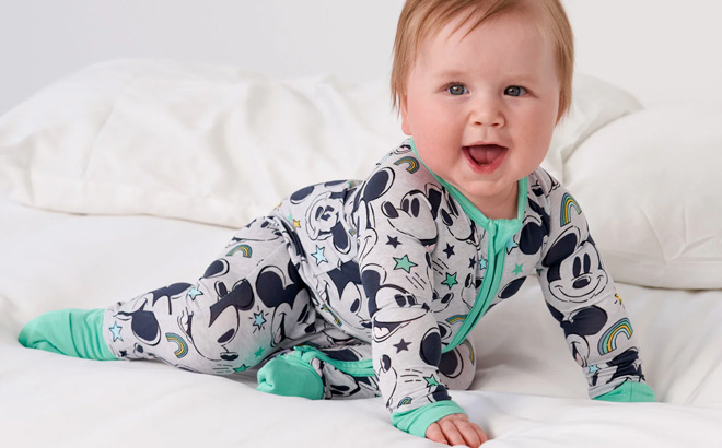 Baby is Wearing Disney Mickey Forever Zippy on the Bed