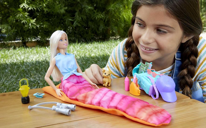 Girl Playing with Barbie Malibu Camping Playset with Doll