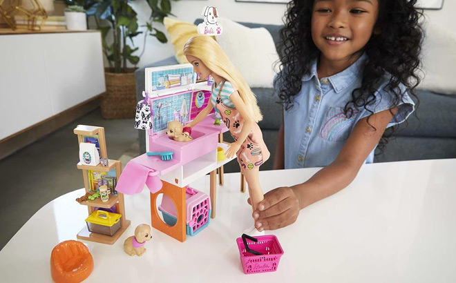 Girl Playing with Barbie Pet Boutique with 4 Pets Playset