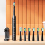 Bitvae Ultrasonic Electric Toothbrush Set on a Wooden Table