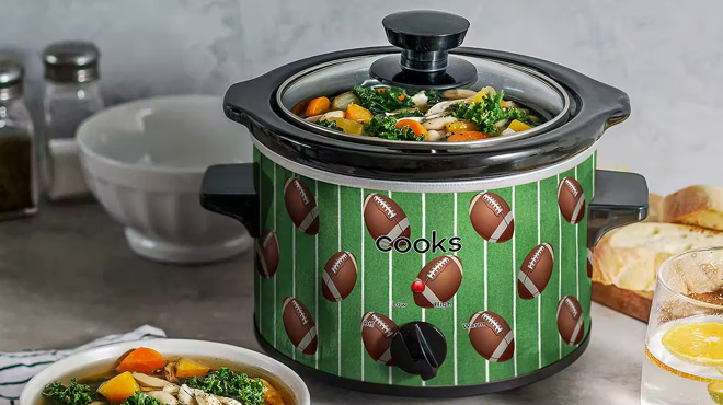 https://www.freestufffinder.com/wp-content/uploads/2023/10/Cooks-1.5-Quart-Slow-Cooker-with-Football-Print-on-the-Table.jpg