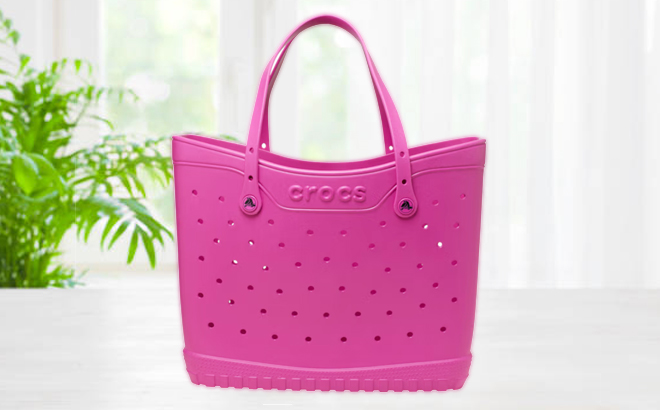 Crocs Classic Tote Bag in Juice Pink Color on a Table