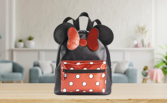 Disneys Minnie Mouse Polka Dot Mini Backpack on the table