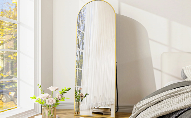 Full Length Arched Standing Mirror Inside a Bedroom