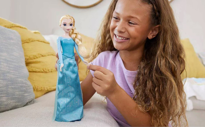 Girl Playing with Disney Frozen Elsa Fashion Doll 1