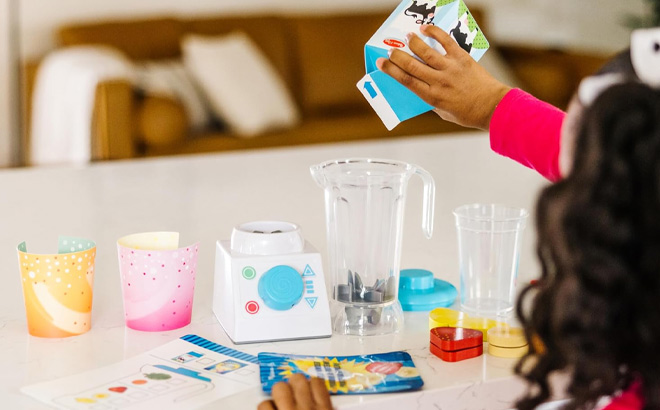 Girl is Playing with Melissa Doug Smoothie Maker Blender Set with Play Food