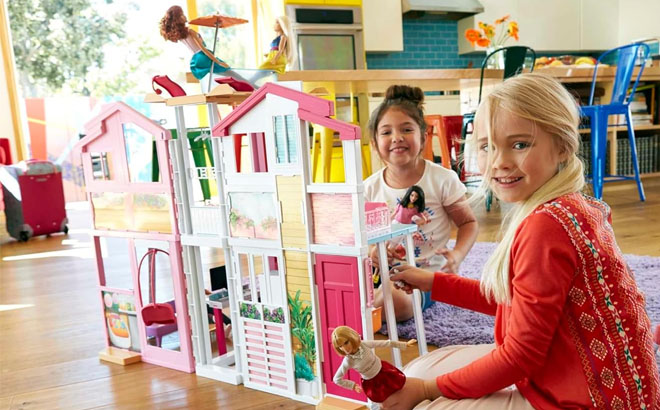 Girls Playing with a Barbie Doll 3 Story House
