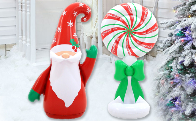 Gnome and Peppermint Candy Christmas Inflatables in a Backyard with Snow