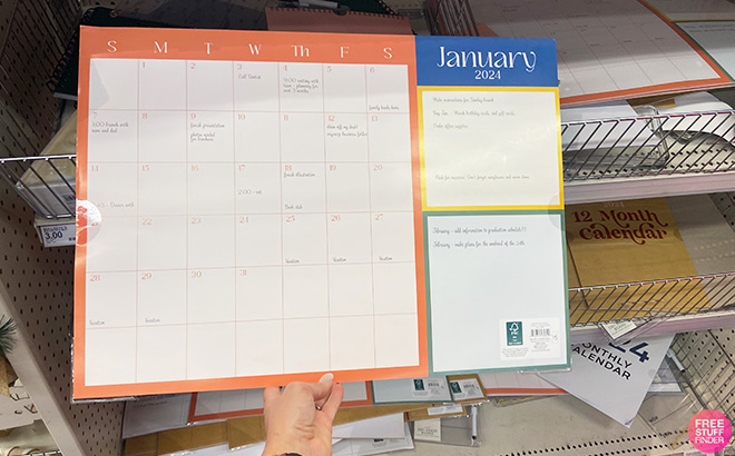 Hand Holding Bullseye Calendar Planner