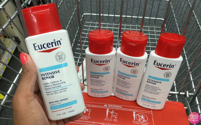 Hand Holding Eucerin Intensive Repair Very Dry Skin Lotion with More in the Background on a Cart at CVS