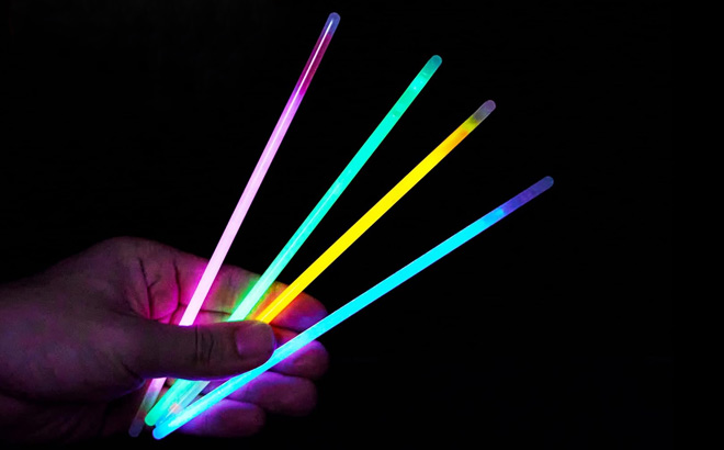 Hand Holding Four Joyin Glow Sticks