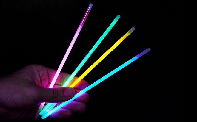 Hand Holding Four Joyin Glow Sticks Hand Holding Four Joyin Glow Sticks