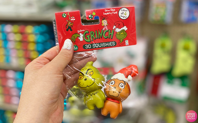 Hand Holding Grinch Max Squishies at Hobby Lobby