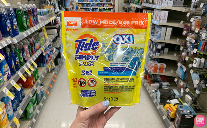 Hand Holding Tide Simply Oxi Pods