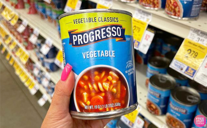 Hand Holding a Can of Progresso Vegetable Soup at Vons