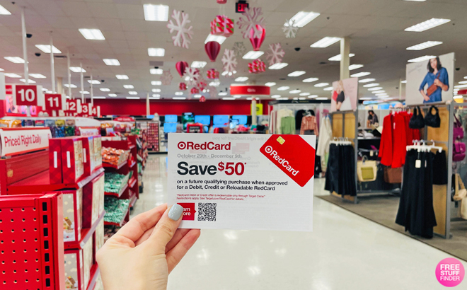Hand Holding a Card for 50 off 50 Promo for New Redcard Holders