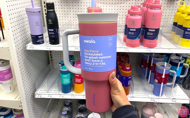 Hand holding Owala 40 Ounce Stainless Steel Tumbler Pink Taupe Hand holding Owala 40 Ounce Stainless Steel Tumbler Pink Taupe