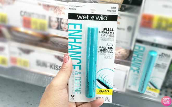 Hand holding Wet n Wild Enhance Megawear Mascara In a shop