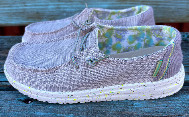 Hey Dude Wendy Youth Stretch Shoes on Wooden Bench Hey Dude Wendy Youth Stretch Shoes on Wooden Bench