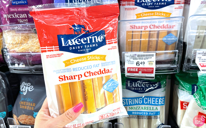 Holding a Lucerne Dairy Farms Cheese Sticks Pack