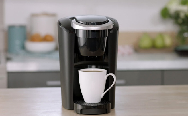 Keurig K Compact Single Serve K Cup Pod Coffee Maker in Black Color on the Kitchen Table