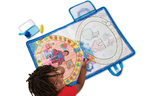 Kid is Playing with Melissa Doug Activity Mat with Reusable Water Reveal Surface