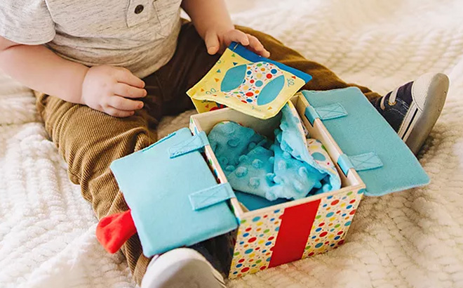 Kid is Playing with Melissa Doug Wooden Surprise Gift Box Infant Toy