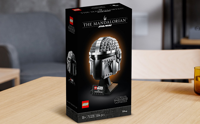 LEGO Star Wars The Mandalorian Helmet Building Set on a Wooden Table
