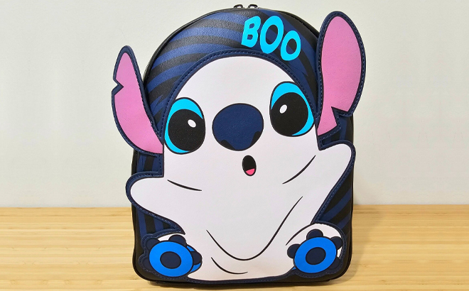 Loungefly Disney Lilo & Stitch Ghost Stitch Glow In The Dark Mini Backpack on a Table
