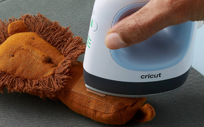 Man is Using Cricut EasyPress Mini on the Toy
