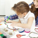 Mom and Daughter Using the Redtwo 5100 Clay Beads Bracelet Making Kit