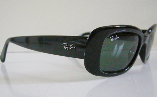 Ray Ban RB4122 with Green Lenses in Black Color on the Table
