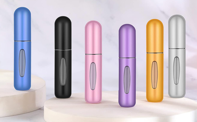 Six Refillable Mini Spray Bottles in Various Colors