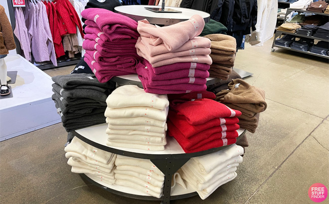Sweaters on a Shelf in a Store