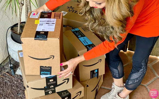 A Person Moving Amazon Delivery Boxes in Front of Their Home